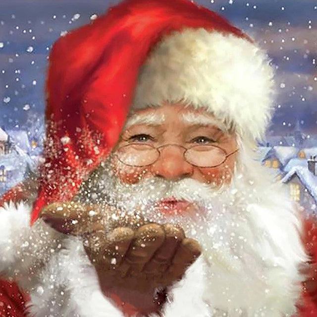 Kerstman blaast sneeuw